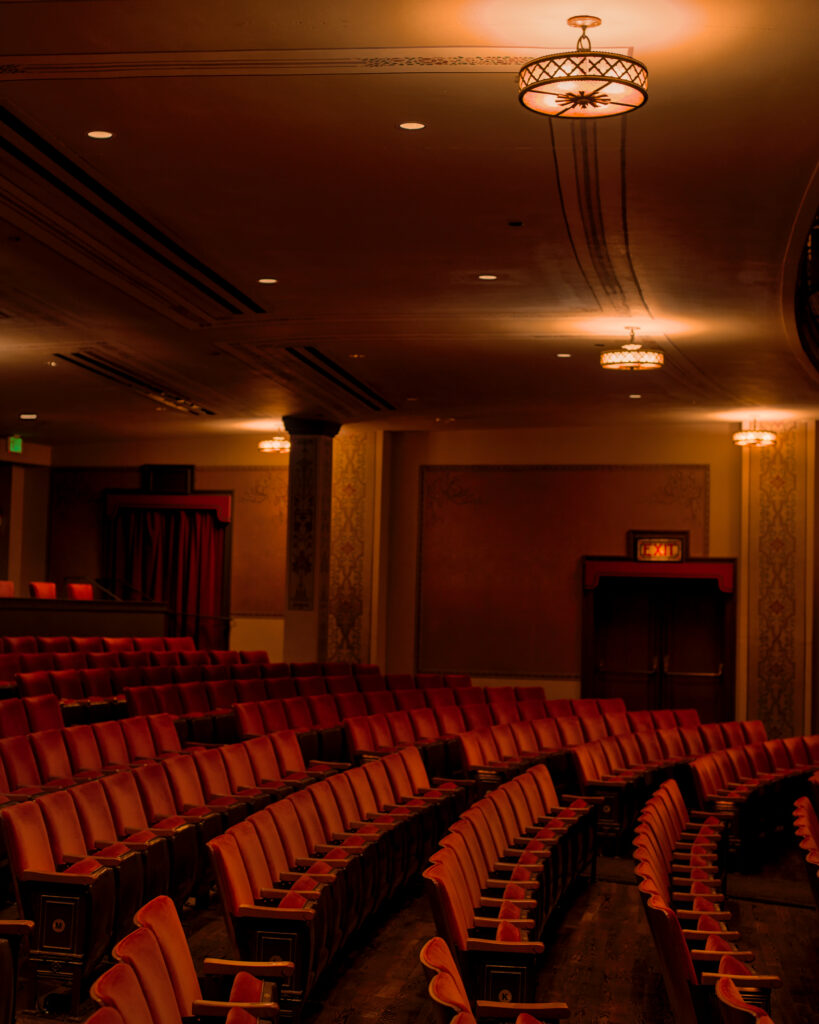 Red velvet seats and timeless incandescant lights adorn the Columbia Theatre performance hall, Copyright Jacob Greenslade
