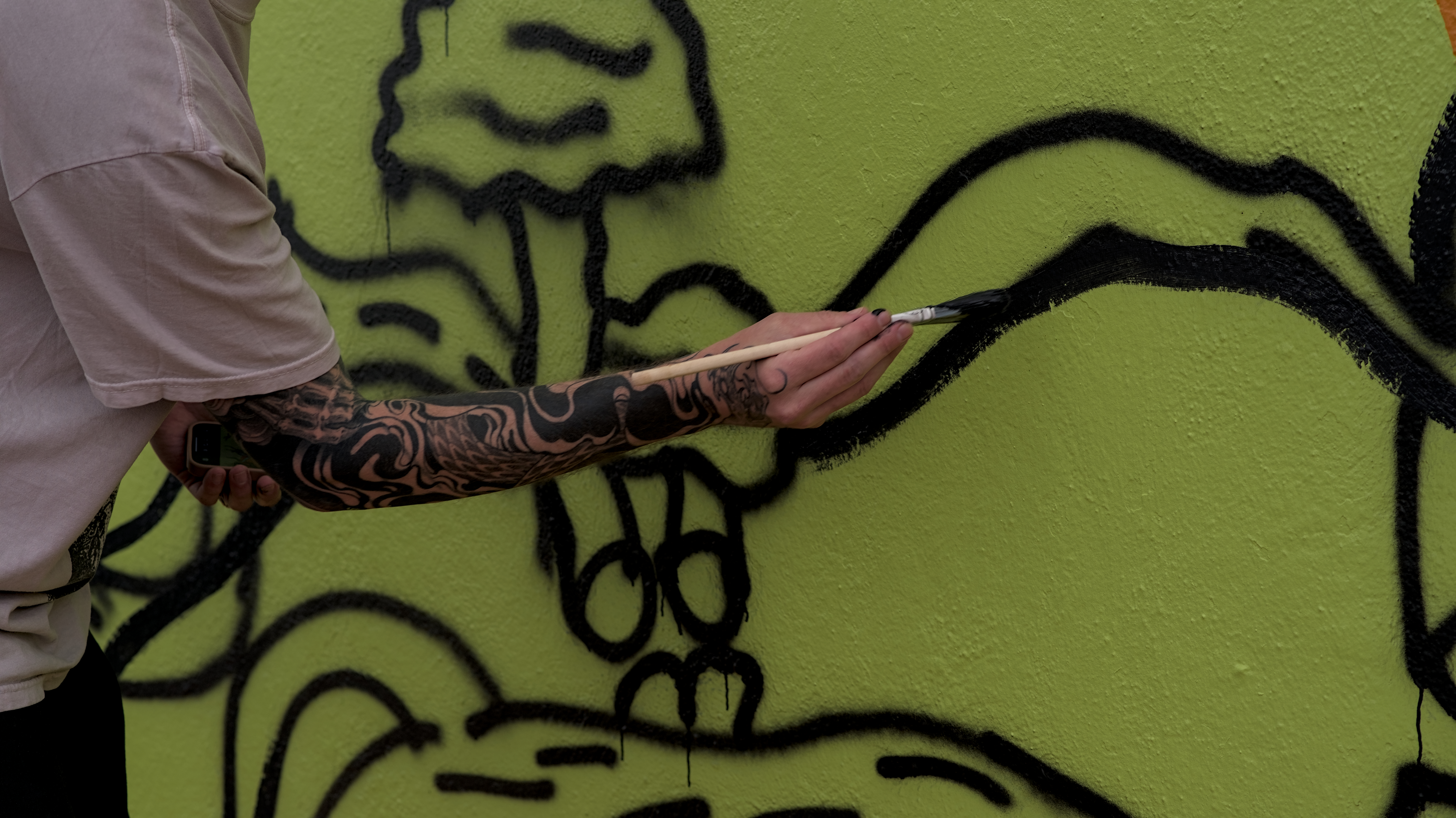 Colorful acrylic mural painted by artist Alex Lilley in Longview, Washington, created through The Broad Strokes Project nonprofit as a collaborative public art installation on a city building in the Lower Columbia region.