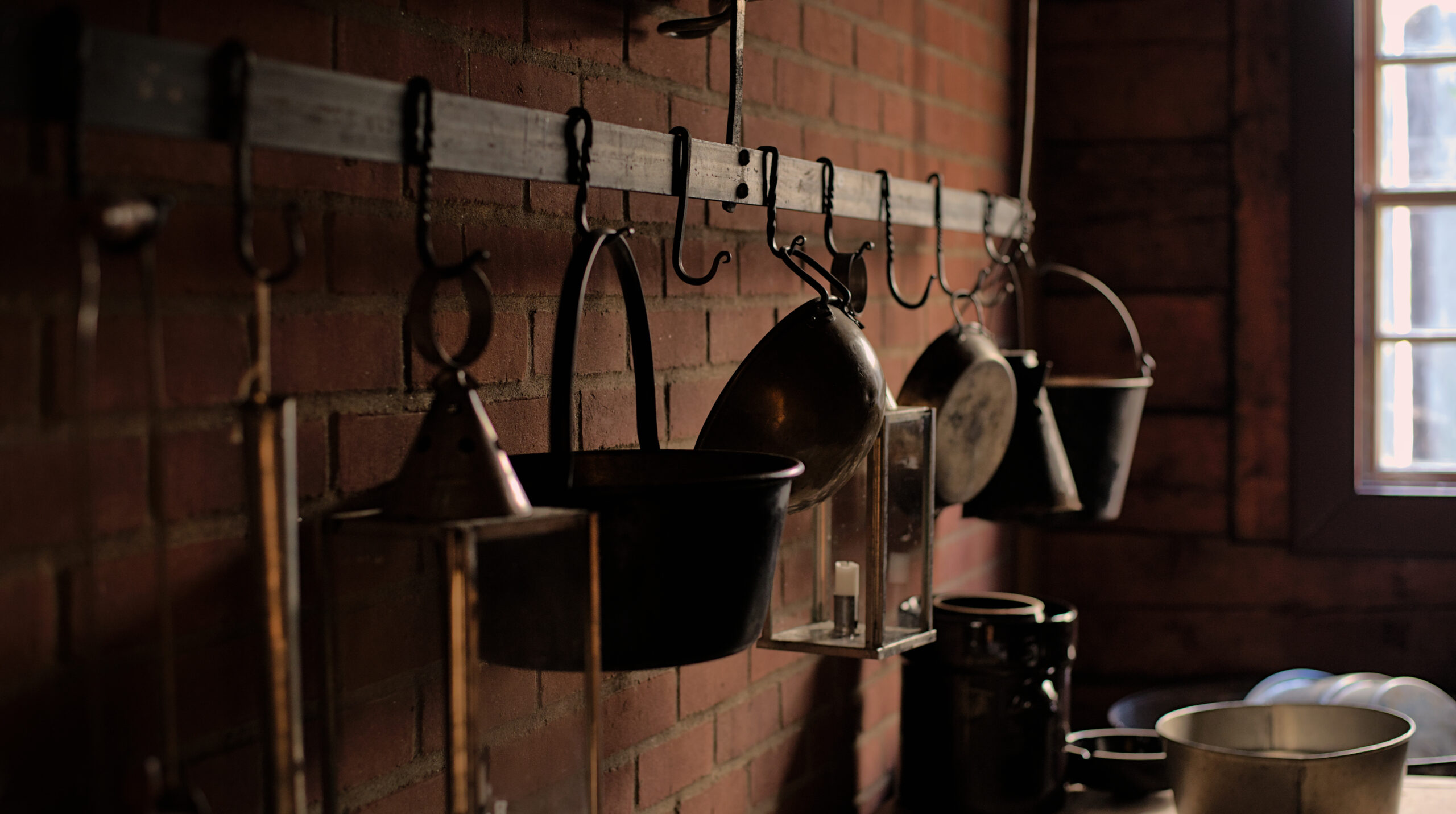 Historical reenactors in period costumes at Fort Vancouver National Historic Site in Vancouver, Washington, depicting 19th century fur trade era with restored buildings, museum displays, and living history exhibits.