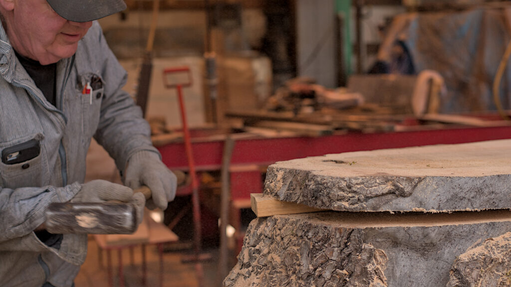 Bob’s Big Boards backyard sawmill in Longview, Washington, producing custom lumber and handcrafted wood slabs with local timber, artisanal milling equipment, and Pacific Northwest craftsmanship in a rural workshop setting.