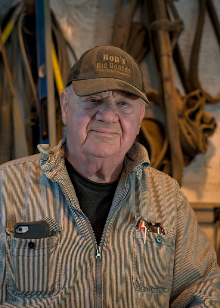 Bob’s Big Boards backyard sawmill in Longview, Washington, producing custom lumber and handcrafted wood slabs with local timber, artisanal milling equipment, and Pacific Northwest craftsmanship in a rural workshop setting.