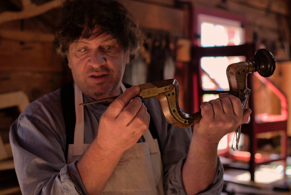 Historical reenactors in period costumes at Fort Vancouver National Historic Site in Vancouver, Washington, depicting 19th century fur trade era with restored buildings, museum displays, and living history exhibits.