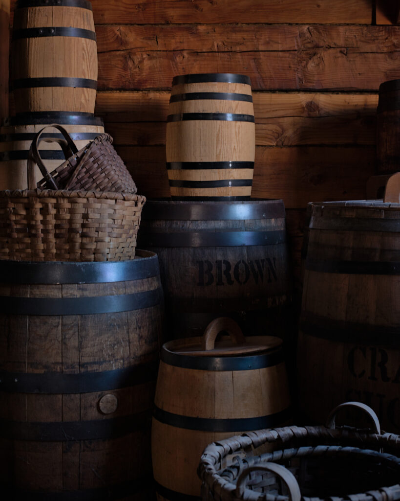 Historical reenactors in period costumes at Fort Vancouver National Historic Site in Vancouver, Washington, depicting 19th century fur trade era with restored buildings, museum displays, and living history exhibits.