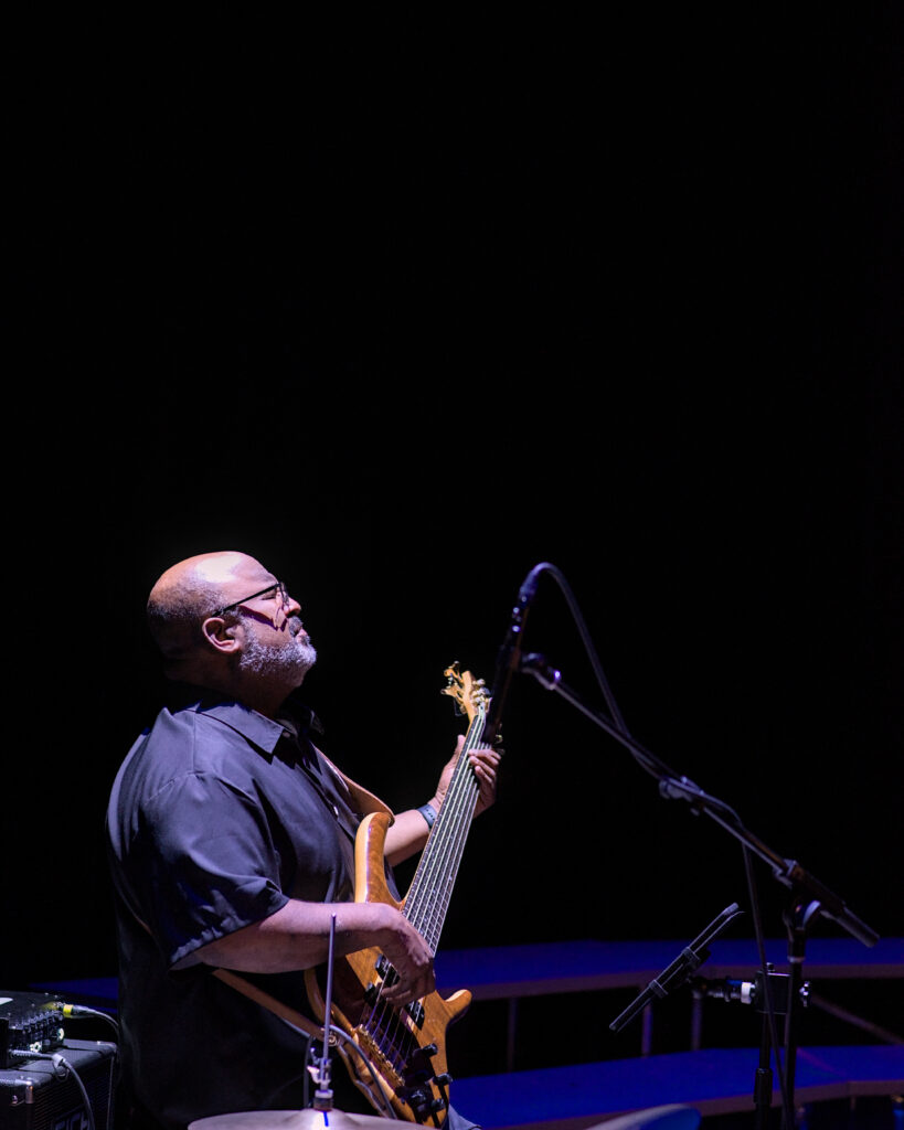 LaRhonda Steele performing live soul, blues, and jazz music on stage at the historic Columbia Theatre in Longview, Washington, during the venue’s centennial celebration with band and community choir.