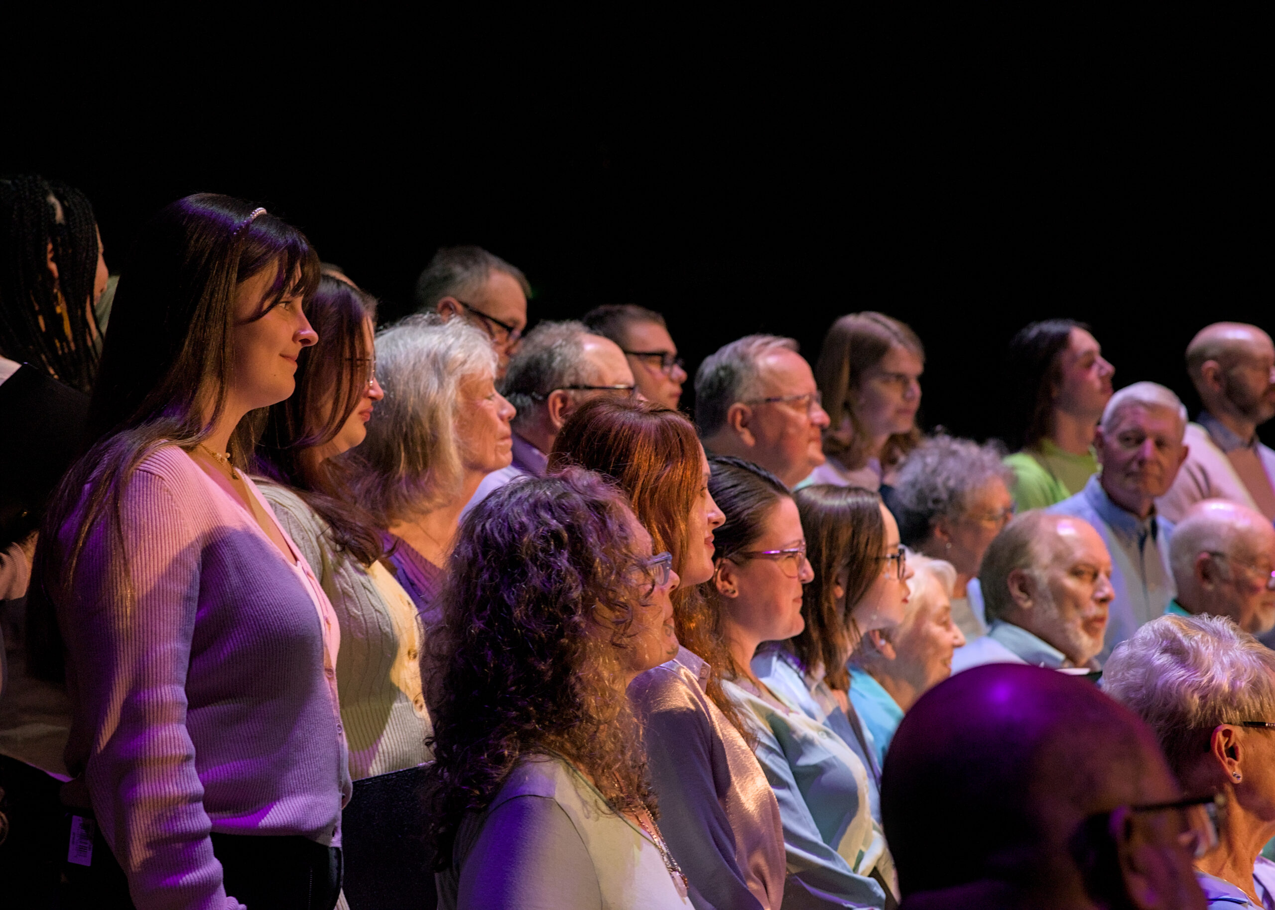 LaRhonda Steele performing live soul, blues, and jazz music on stage at the historic Columbia Theatre in Longview, Washington, during the venue’s centennial celebration with band and community choir.