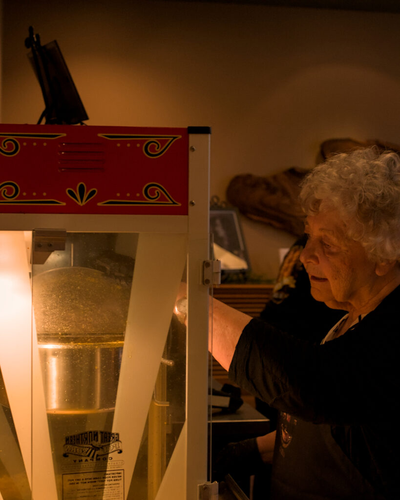 LaRhonda Steele performing live soul, blues, and jazz music on stage at the historic Columbia Theatre in Longview, Washington, during the venue’s centennial celebration with band and community choir.