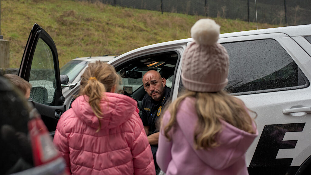 Kalama Police Department officers interacting with the community, including conducting traffic stops, giving preschool children a tour of the station, and participating in National Night Out events in Southwest Washington.