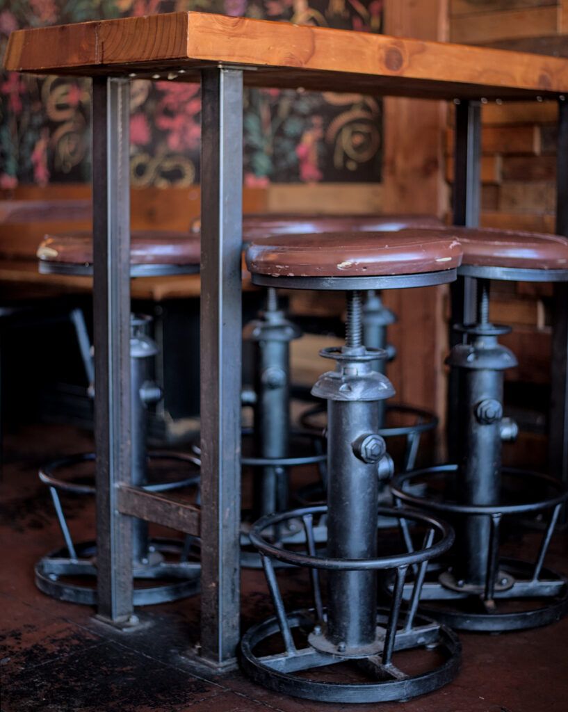 Candid photos inside the Thirsty Sasquatch and Hungry Sasquatch in Vancouver, Washington, showing pizza, craft beer, bar seating, and arcade games in a lively local restaurant and pub setting.