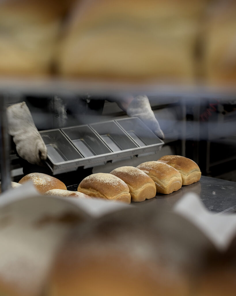 Artisan bakery in Kalama, Washington, featuring freshly baked sourdough bread, wheat loaves, buns, and pizza dough made with a local starter and baked in a traditional oven in the Lower Columbia region.