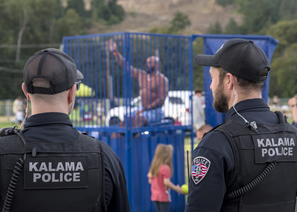 Kalama Police Department officers interacting with the community, including conducting traffic stops, giving preschool children a tour of the station, and participating in National Night Out events in Southwest Washington.